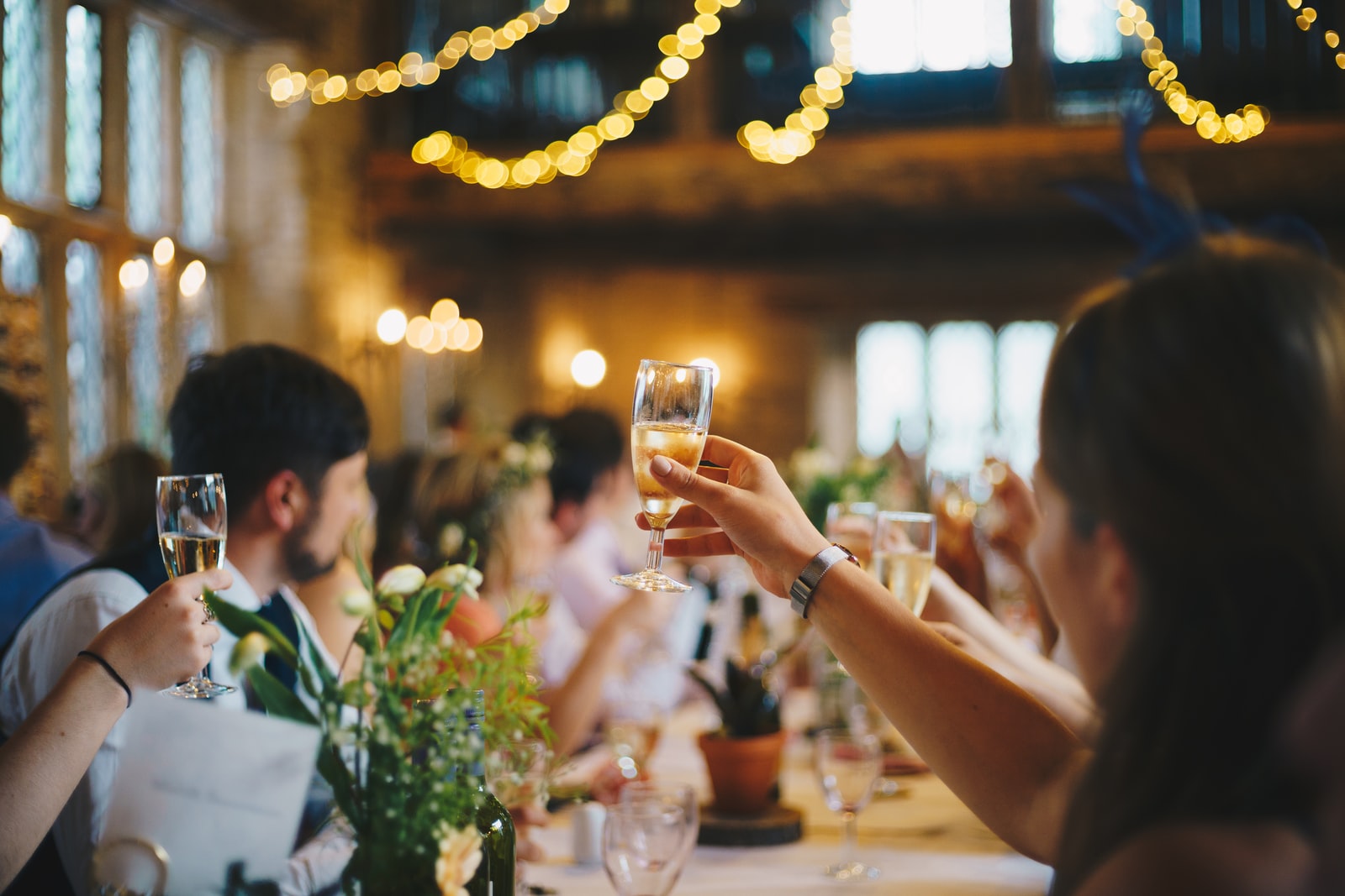 individuals toasting at a wedding